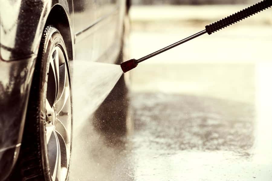 Car wheel being cleaned