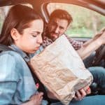 Our Tips for Avoiding Travel Sickness woman suffering from travel sickness