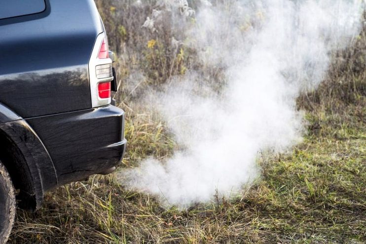 smoke fumes coming from a car exhaust