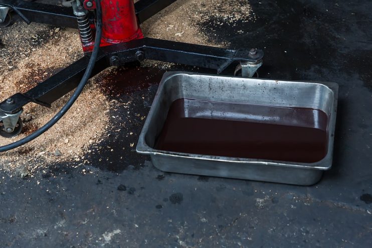 car waste oil in a tray