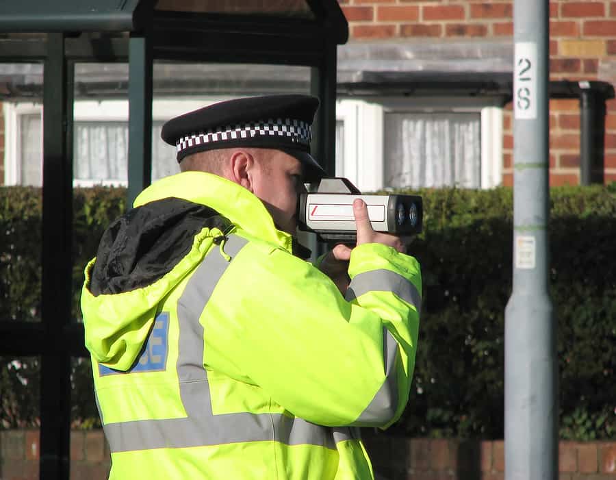 policeman with a speed camera