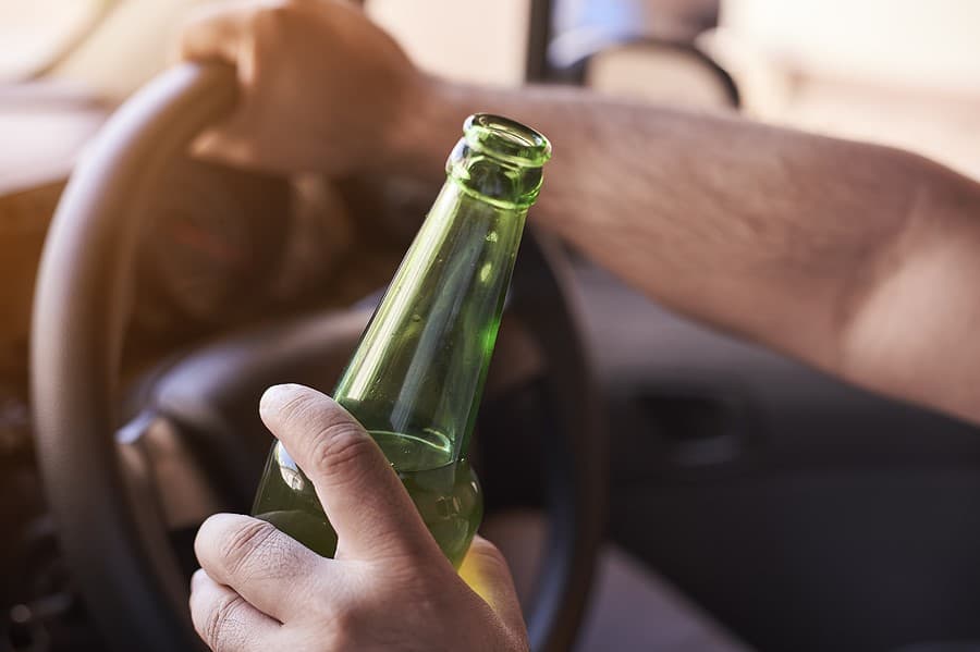 alcohol in a car while someone is driving