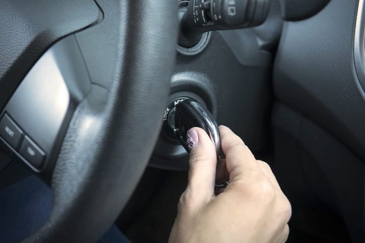 turning a key to start a car