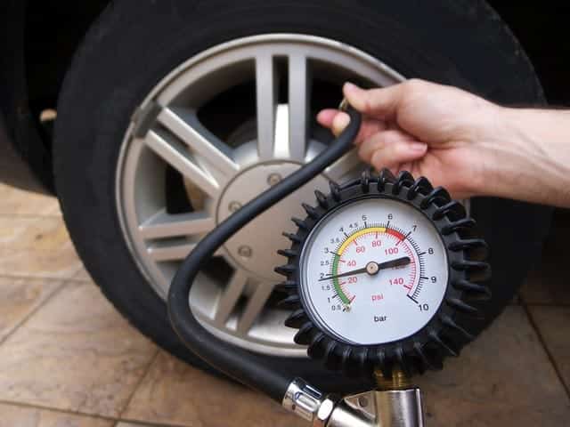 checking tyre pressures in winter
