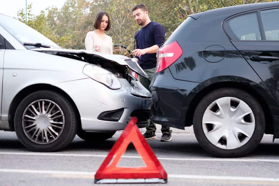 exchanging details with uninsured driver