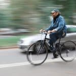 Cyclist And A Car On The Streets Of New York