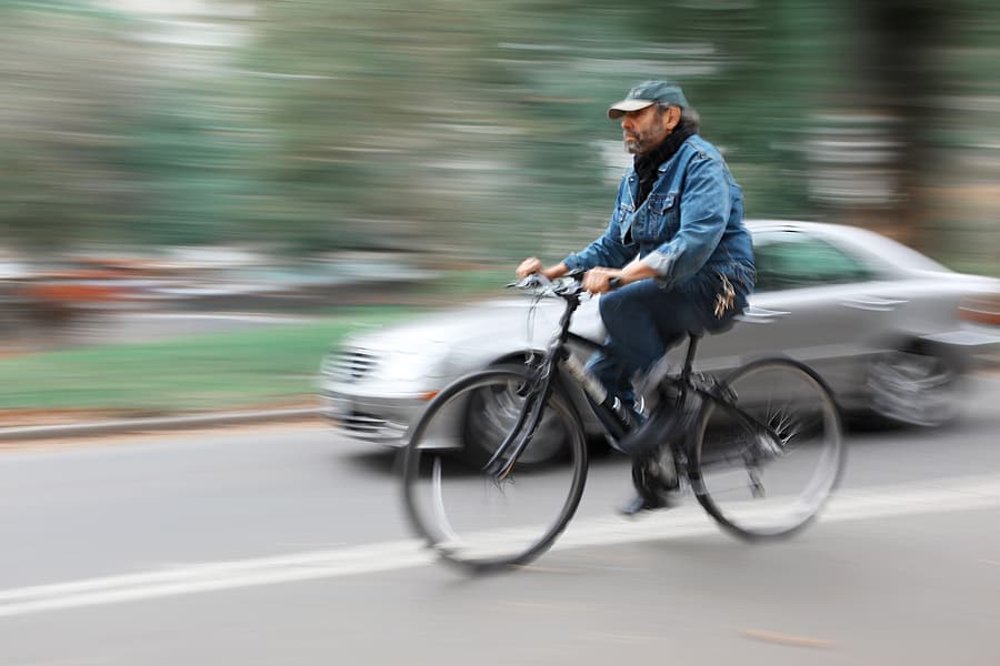 car overtaking a cyclist