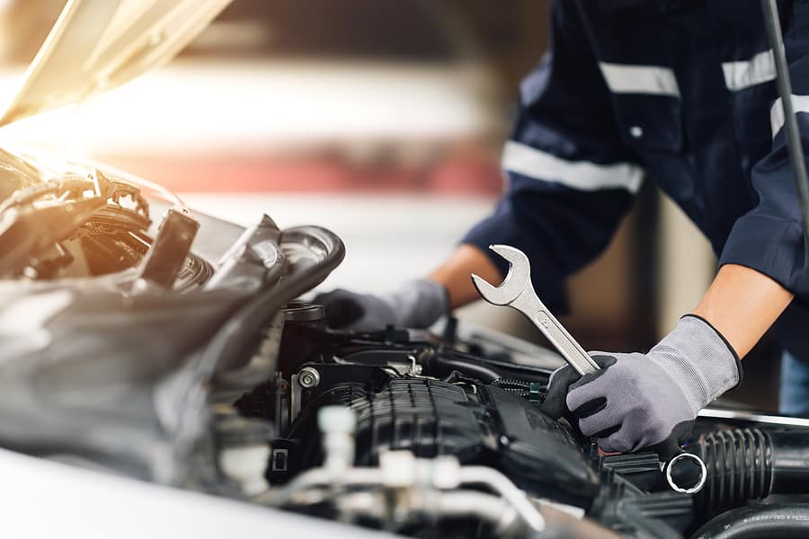 Mechanic performing a service on a car