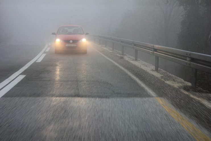 car driving in fog