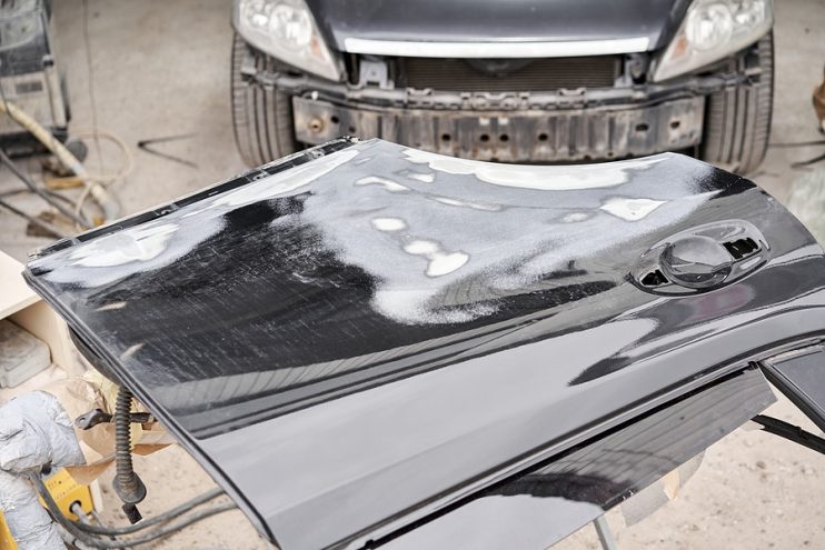 filler being used to repair car damage