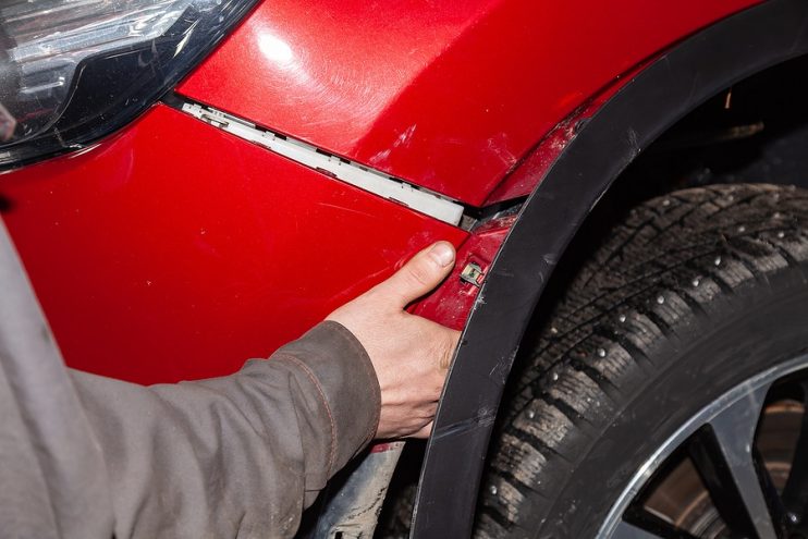 front bumper corner being unclipped