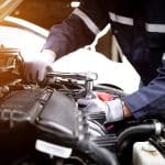 Auto Mechanic Working On Car Engine In Mechanics Garage.repair S