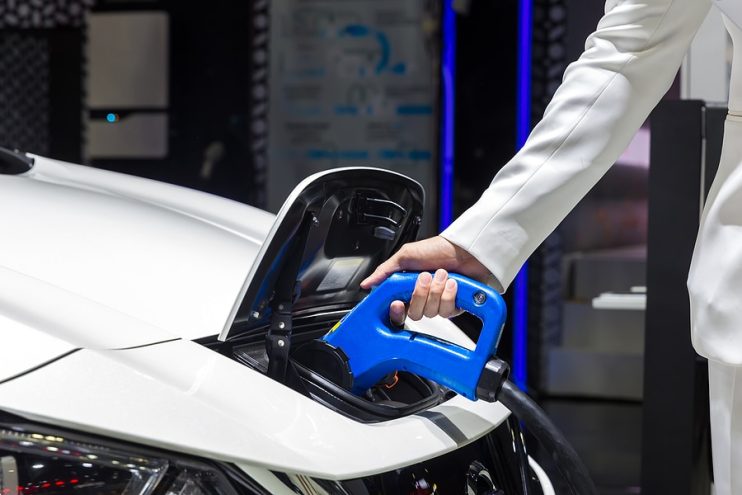 Electric car being plugged in