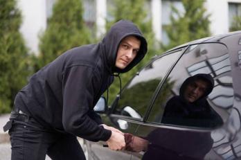 car being broken into by thieves