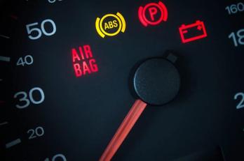 Illuminated dashboard airbag warning light